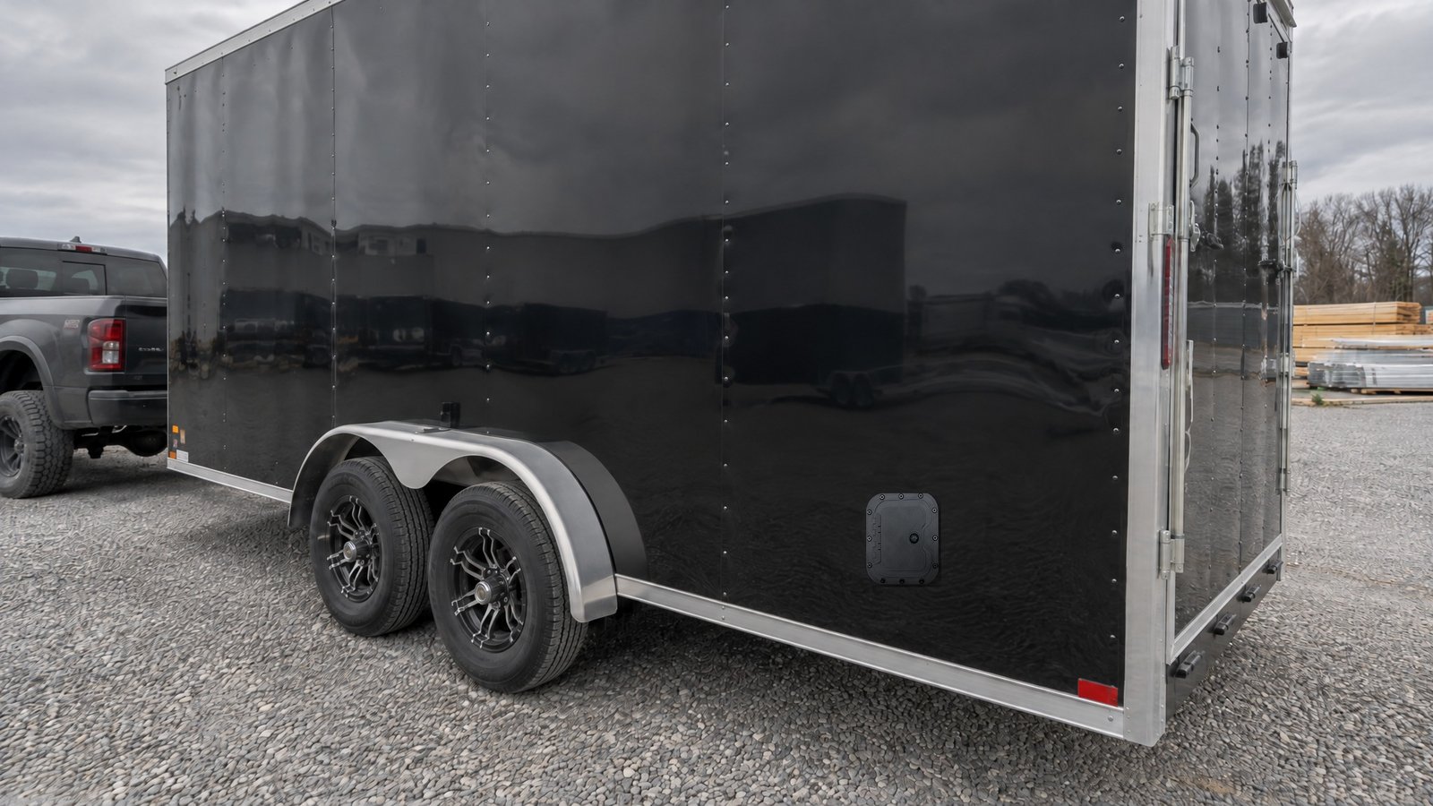 Locking hatch door on the side of a contractor work trailer at a job site